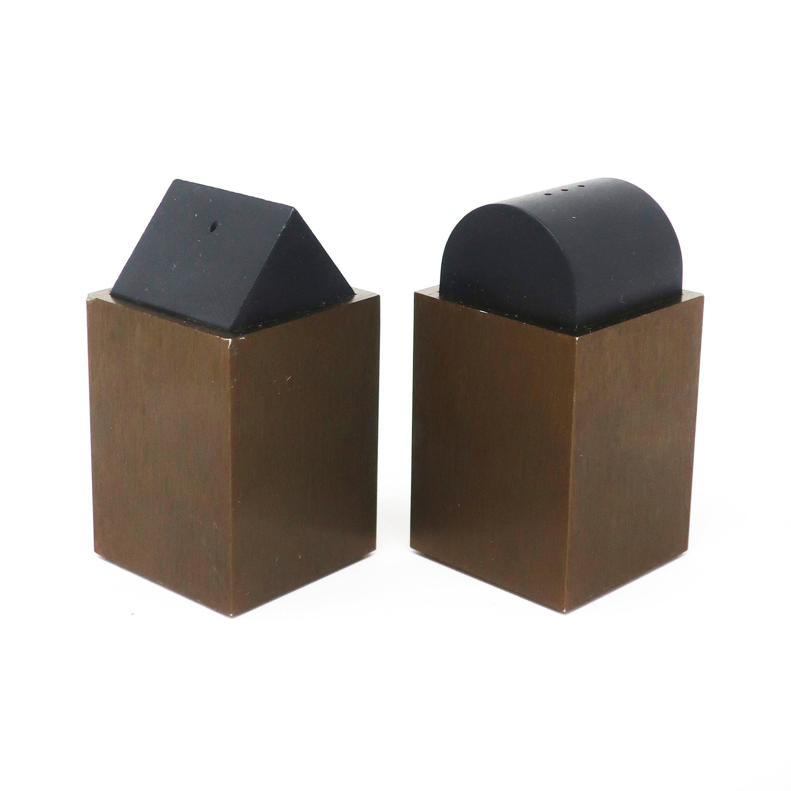 Post Modern Black and Brown Salt & Pepper by David: A lovely pair of postmodern, Memphis inspired salt & pepper shakers by David Tisdale for Elika. Both are brown anodized aluminum while one has a rounded black top and one has a triangle black top. In 