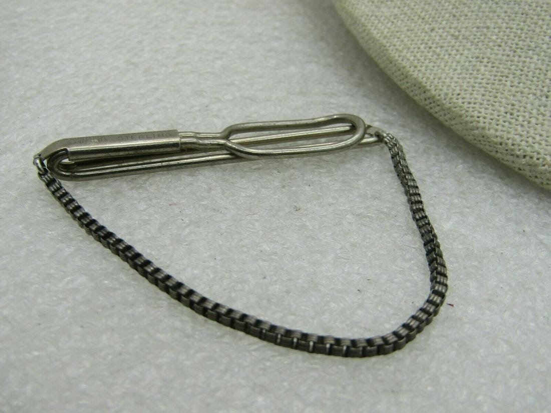 Vintage Swank Sterling Silver Tie Bar: Vintage Swank Sterling Silver Tie Bar Reserve: $20.00 Shipping: Domestic: Flat-rate of $4.00 to anywhere within the contiguous U.S. International: Foreign shipping rates are determined by destination.