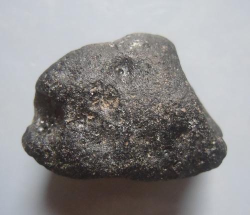 PHILIPPINITE TEKTITE - FROM METEORITE IMPACT: Title: PHILIPPINITE TEKTITE - FROM METEORITE IMPACT Origin: Paracale, Camarines Norte, Luzon, Philippines Size: 2.5x1.5x1 cm / 7 gram Description: irregular rounded and rizalite/philippinite tektite R