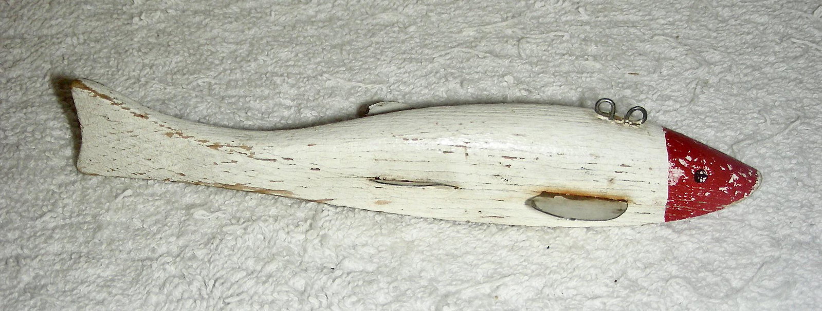 Red & White Fishing Lure Decoy: Title: Red & White Fishing Lure Decoy Provenance/Additional Info: This red and white fishing lure or decoy has a nicely carved body with a curve to the tail. Original working waint with some m inor ch