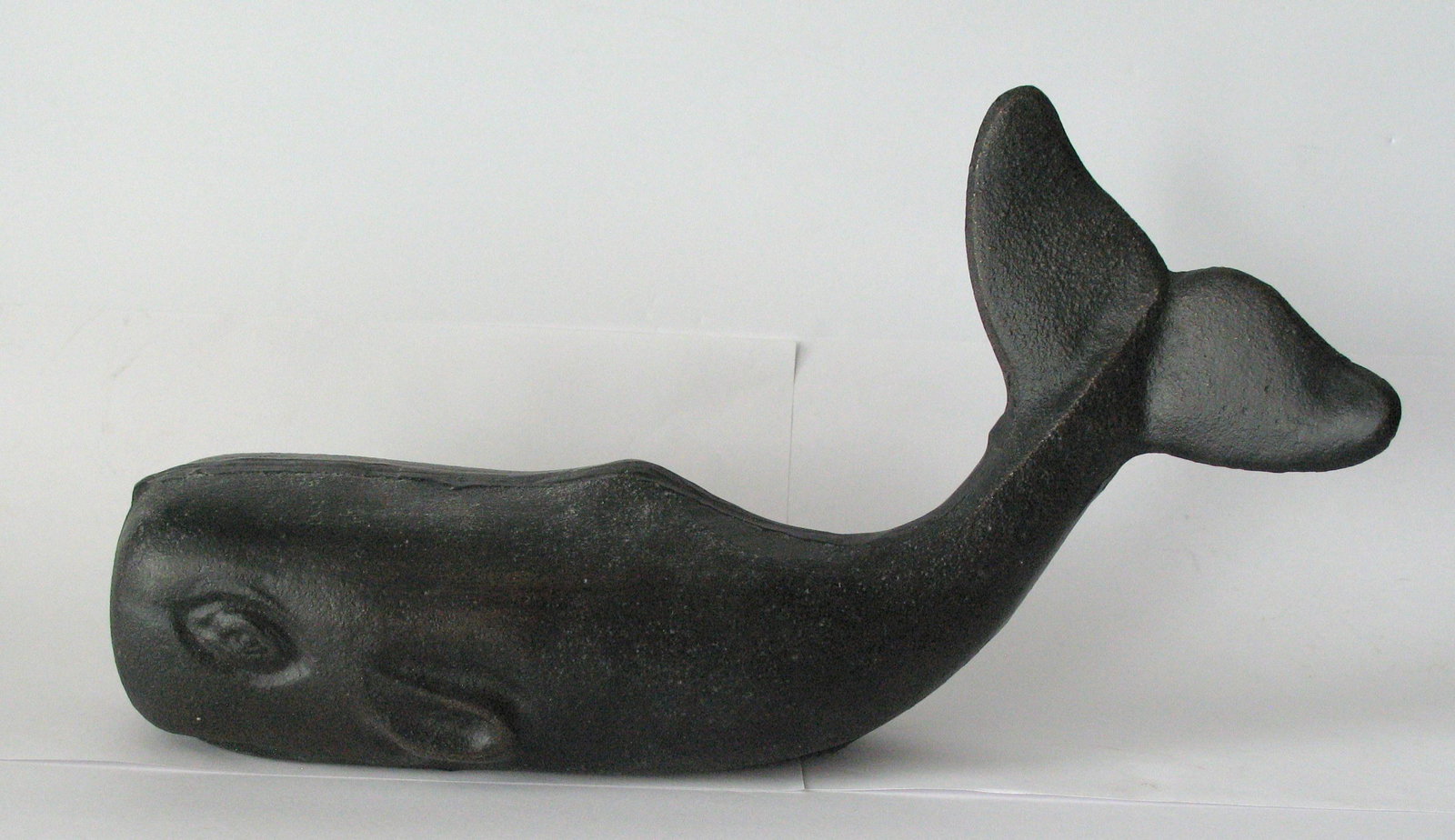 Vintage Cast Iron Whale Doorstop: Title: Vintage Cast Iron Whale Doorstop Date/Period: 1950's Dimension: 12 1/2 Additional Information: Nice vintage cast iron whale doorstop in old black paint. Shipping: Domestic: Flat-rate of $25.00 