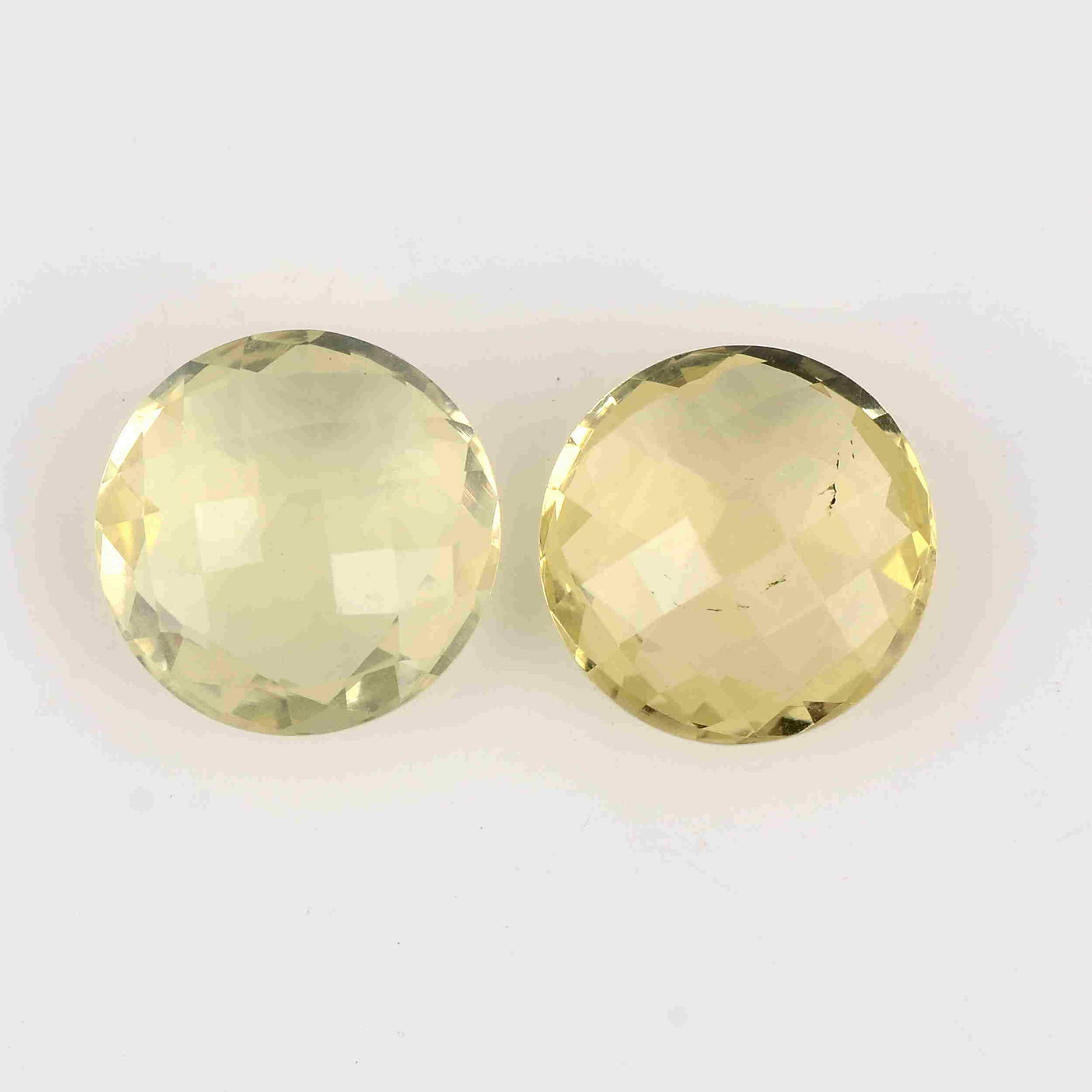 12.50 Carat Yellow Color Natural Round Lemon Quartz: No Reserve! Title: 12.50 Carat Yellow Color Natural Round Lemon Quartz Loose Gemstone 2 Pieces Brand: Gems Trading Center Gemstones: Lemon Quartz Carat Weights: 12.5 Size/Dimensions: 6H x 13L x 13W mm
