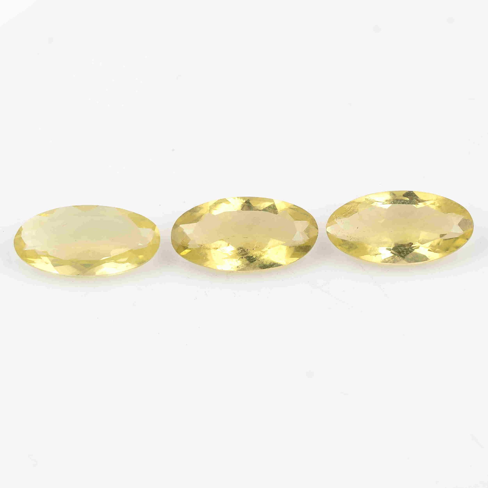 10.75 Carat Yellow Color Natural Oval Lemon Quartz: No Reserve! Title: 10.75 Carat Yellow Color Natural Oval Lemon Quartz Loose Gemstone 3 Pieces Brand: Gems Trading Center Gemstones: Lemon Quartz Carat Weights: 10.75 Size/Dimensions: 4H x 16L x 8W mm 