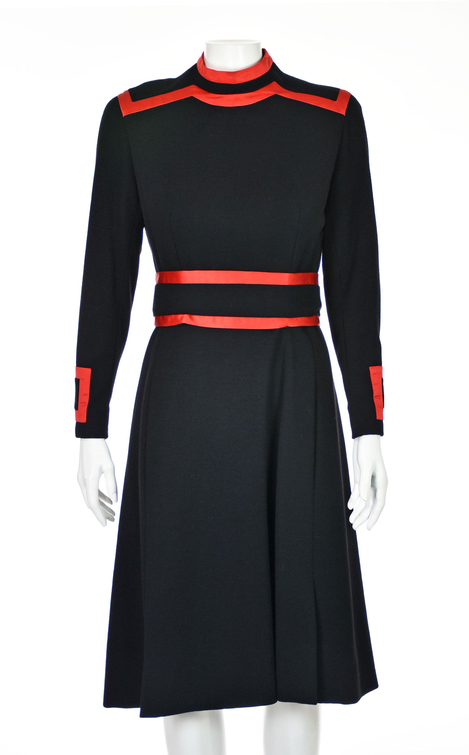RONALD AMEY Vintage Black Wool Knit Dress: This dress is quintessential Ronald Amey from the 1960s or early 1970s. "Fit and flare" style made in black wool knit with a standing collar and extensive red silk trim. The self-belt is loosely attac