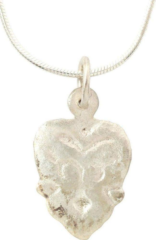 VIKING HEART PENDANT NECKLACE C.900-1050 AD: 5/8" width, slightly domed with a broad foliate border and central trefoil motif. Fully cusped top. The foliate trefoil was a very popular motif for Viking hearts. The form of the heart is natural as 