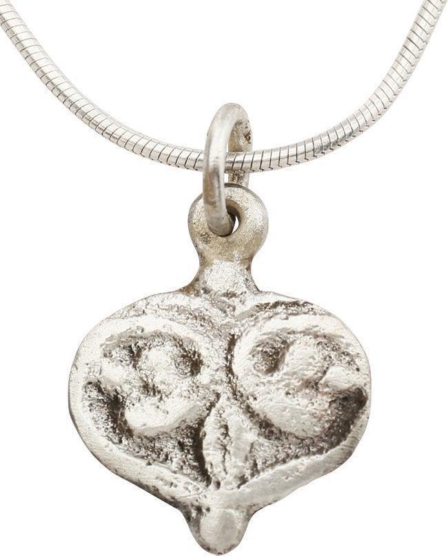 VIKING HEART PENDANT NECKLACE C.850-1050 AD: 5/8" width of fully evolved cusped top heart form. The broad raised borders terminating in the foliate trefoil form central motif. Foliate designs were favored by Vikings and incorporated into about h