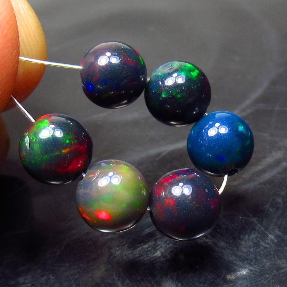 6.50 Ct Natural 6 Drilled Black Fire Opal Ball Beads: Title: 6.50 Ct Natural 6 Drilled Black Fire Opal Ball Beads Stone Clarity: Translucent Gemstone: Natural Black Opal Beads Carat Weight: 6.50 Size/Dimensions: 6.30 to 6.60 mm / 6 PC's Additional Inform