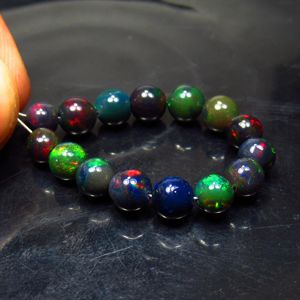 10.95 Ct Natural 15 Drilled Black Fire Opal Ball Beads (1 of 2)