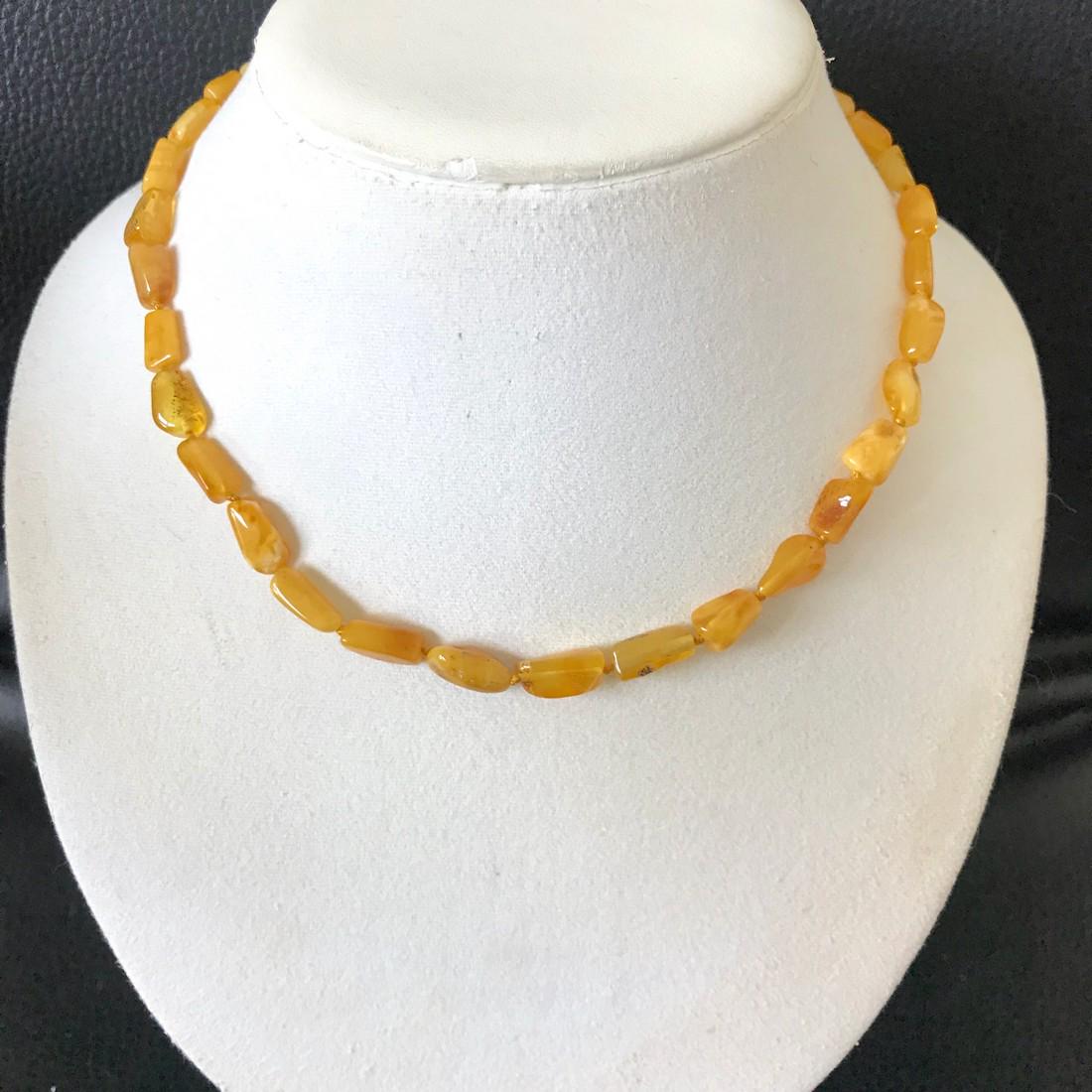 Splendid Amber Necklace made from Natural shaped Amber: Title: Splendid Amber Necklace made from Natural shaped Amber beads Metal Purity: None Gemstone: Amber Weight: 8.8 g Size: Bead size: 11.5 x 6.9 mm Bead size: 0.453 x 0.272 inches Made Of: Whole Stone