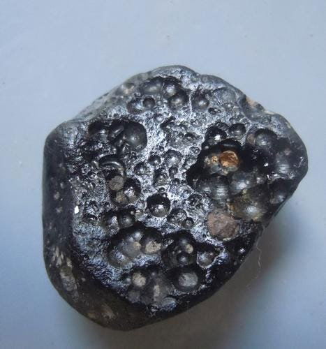 PHILIPPINITE TEKTITE - FROM METEORITE IMPACT: Title: PHILIPPINITE TEKTITE - FROM METEORITE IMPACT Origin: Paracale, Camarines Norte, Luzon, Philippines Size: 2.5x2x1 cm /10 gram Description: flattened irregular shaped rizalite/philippinite tektit