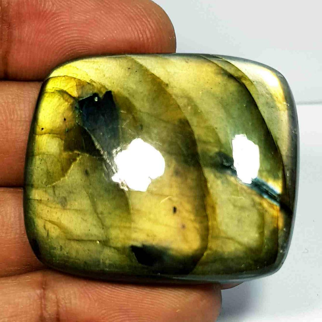 96.75 Ct Natural Labradorite: No Reserve! Title: 96.75 Ct Natural Labradorite Color/Clarity: Opaque Carat Weight: 96.75 Size/Dimensions: 38.25 x 32.25 x 8.10 Additional Information: Rectangular - USA Shipping: Domestic: Flat-
