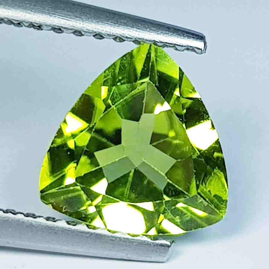 1.62 Ct Natural Peridot Triangle Cut: No Reserve! Title: 1.62 Ct Natural Peridot Triangle Cut Color/Clarity: IF - VVS Carat Weight: 1.62 Size/Dimensions: 8.00 x 7.80 x 4.00 Additional Information: Triangle / Pakistan Shipping: Domestic: