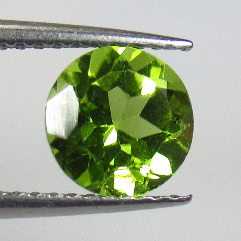 1.51 Ct Natural Pakistan Peridot Round Cut: No Reserve! Title: 1.51 Ct Natural Pakistan Peridot Round Cut Stone Clarity: VVS Gemstone: Natural Peridot Carat Weight: 1.51 Dimensions: 7.00 x 7.00 x 4.60 mm Additional Information: Top Class Full L