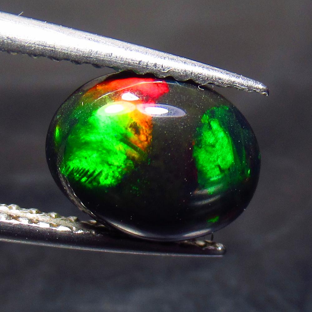 1.16 Ct Natural Ethiopian Black Fire Opal Oval Cab: No Reserve! Title: 1.16 Ct Natural Ethiopian Black Fire Opal Oval Cab Stone Clarity: Translucent Gemstone: Natural Black Opal Carat Weight: 1.16 Dimensions: 9.10 x 7.10 x 3.90 mm Additional Informatio