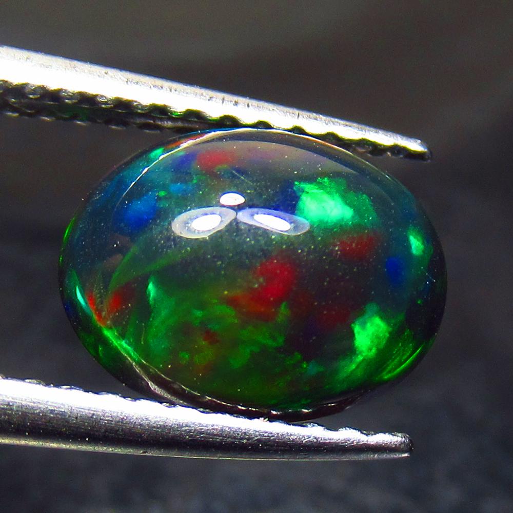 1.33 Ct Natural Ethiopian Black Fire Opal Oval Cab: No Reserve! Title: 1.33 Ct Natural Ethiopian Black Fire Opal Oval Cab Stone Clarity: Translucent Gemstone: Natural Black Opal Carat Weight: 1.33 Dimensions: 9.20 x 7.10 x 4.60 mm Additional Informatio