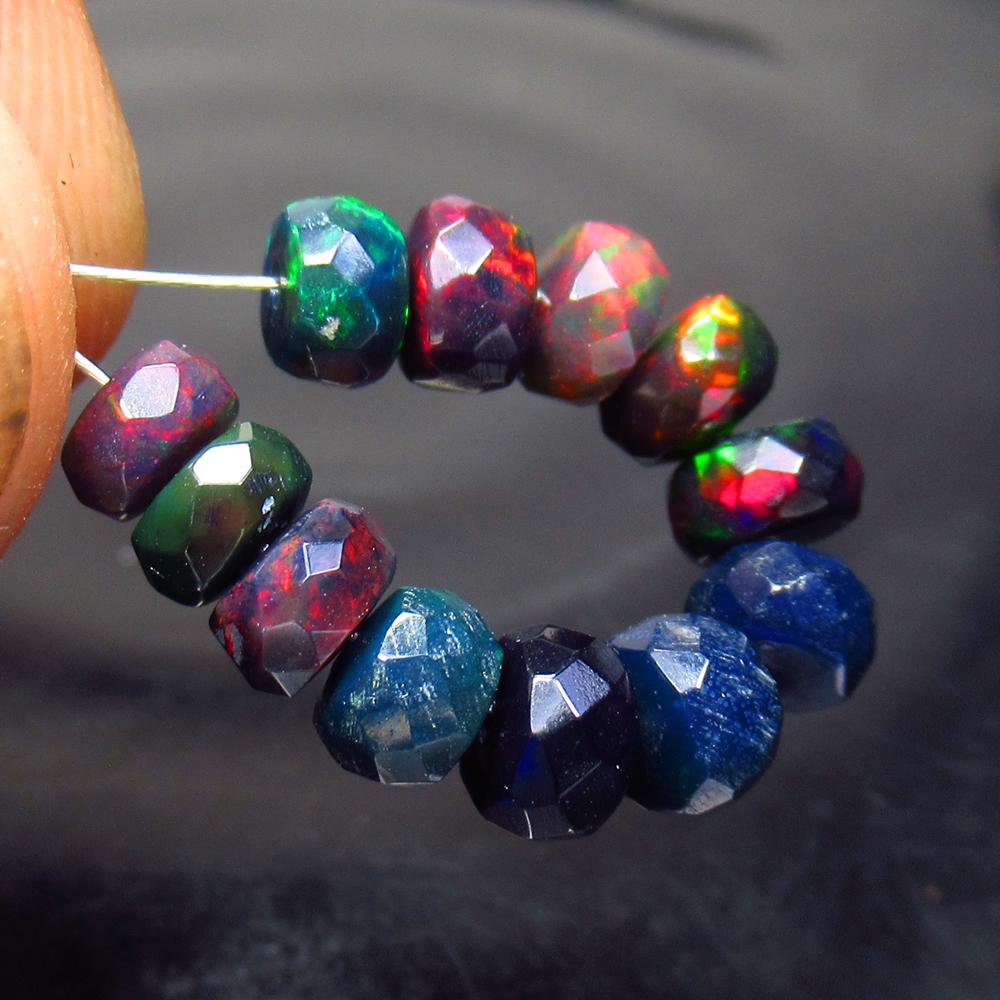 5.30 Ct Natural 12 Drilled Black Faceted Fire Opal: No Reserve! Title: 5.30 Ct Natural 12 Drilled Black Faceted Fire Opal Beads Stone Clarity: Translucent Gemstone: Natural Faceted BlackOpal Beads Carat Weight: 5.3 Dimensions: 4.80 to 5.20 mm / 12 PC's