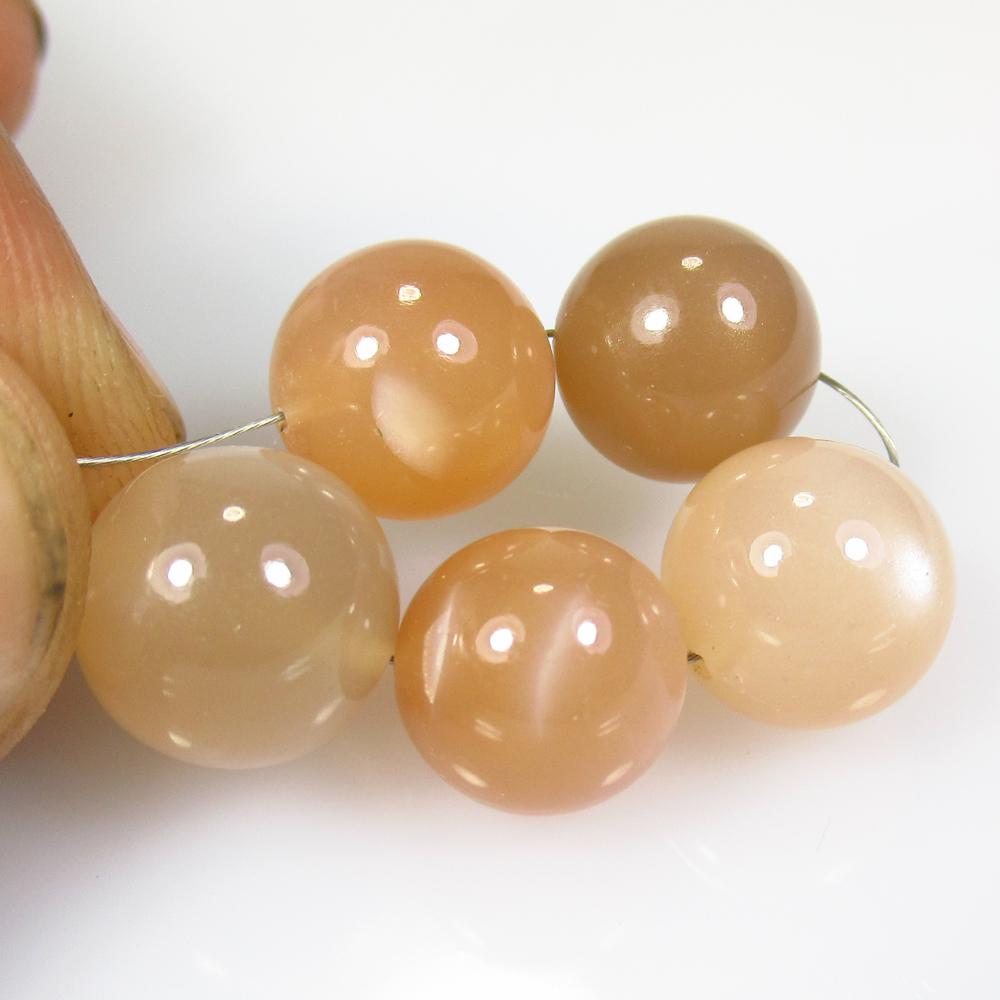 36.07 Ct Natural 5 Drilled Moonstone Ball Beads: No Reserve! Title: 36.07 Ct Natural 5 Drilled Moonstone Ball Beads Stone Clarity: Semi-Transparent Gemstone: Natural Moonstone Beads Carat Weight: 36.07 Dimensions: 9.80 to 10.50 mm / 5 PC's Additiona