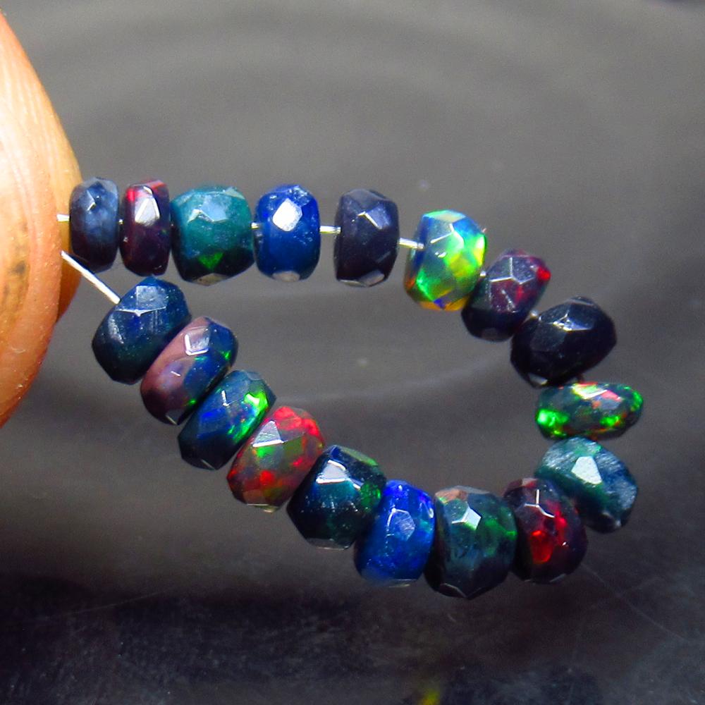 4.10 Ct Natural 18 Drilled Black Faceted Fire Opal: No Reserve! Title: 4.10 Ct Natural 18 Drilled Black Faceted Fire Opal Beads Stone Clarity: Translucent Gemstone: Natural Faceted BlackOpal Beads Carat Weight: 4.1 Dimensions: 3.60 to 4.50 mm / 18 PC's