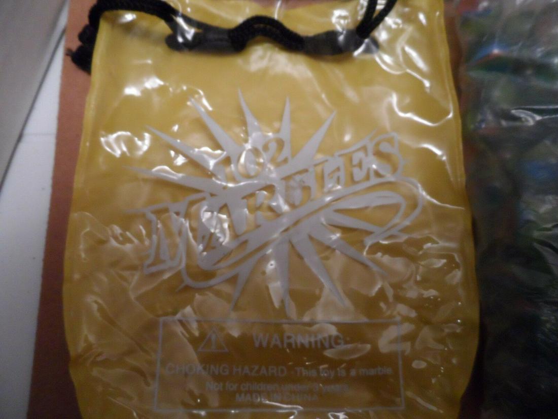 Vintage Marbles Original Unopened Bag with Carry Bag: Title: Vintage Marbles Original Unopened Bag with Carry Bag Approx 50 Marbles Unknown date Date/Period: Unknown Reserve: $5.00 Shipping: Domestic: Flat-rate of $10.00 to anywhere within the contiguous