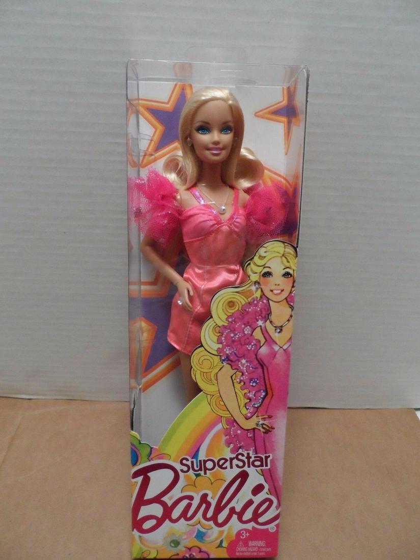 2010-Superstar Barbie - NRFB: Title: 2010-Superstar Barbie - NRFB Model# T2408 Date/Period: 2010 Reserve: $5.00 Shipping: Domestic: Flat-rate of $10.00 to anywhere within the contiguous U.S. International: Foreign shipping rates a