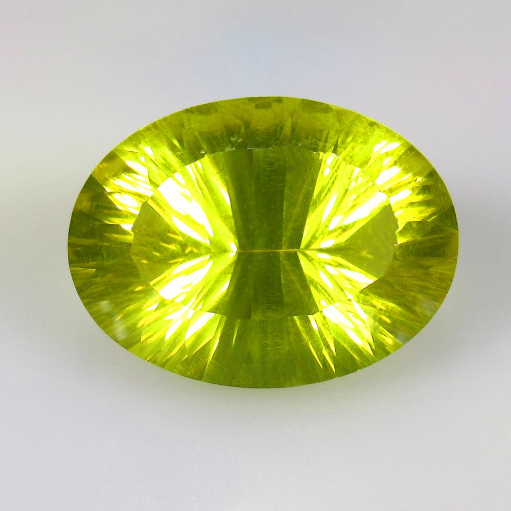 23.64 Ctw Natural Lemon Quartz Concave Cut: Title: 23.64 Ctw Natural Lemon Quartz Concave Cut Stone Clarity: VVS Gemstones: Lemon Quartz Carat Weights: 23.64 Size/Dimensions: 24.00 x 17.40 x 10.80 mm Additional Information: Good Luster / Top Cl