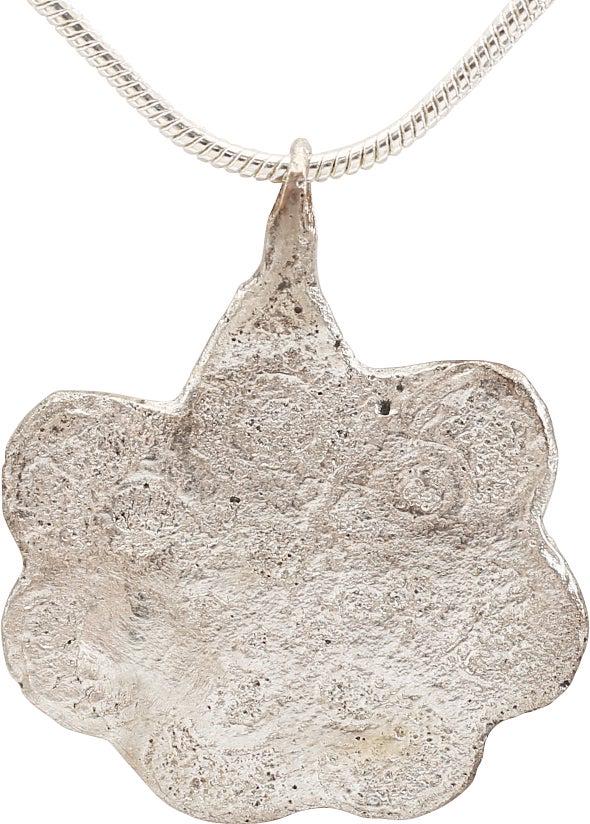 ENGLISH TUDOR LADIES PENDANT NECKLACE. C.1485-1603: The period of Henry VIII and Elizabeth I. Silvered bronze, just under 1" height. Scalloped edge surrounding a seven-spoke wheel, a reference to the Tudor rose. Originally made in low relief and now wo