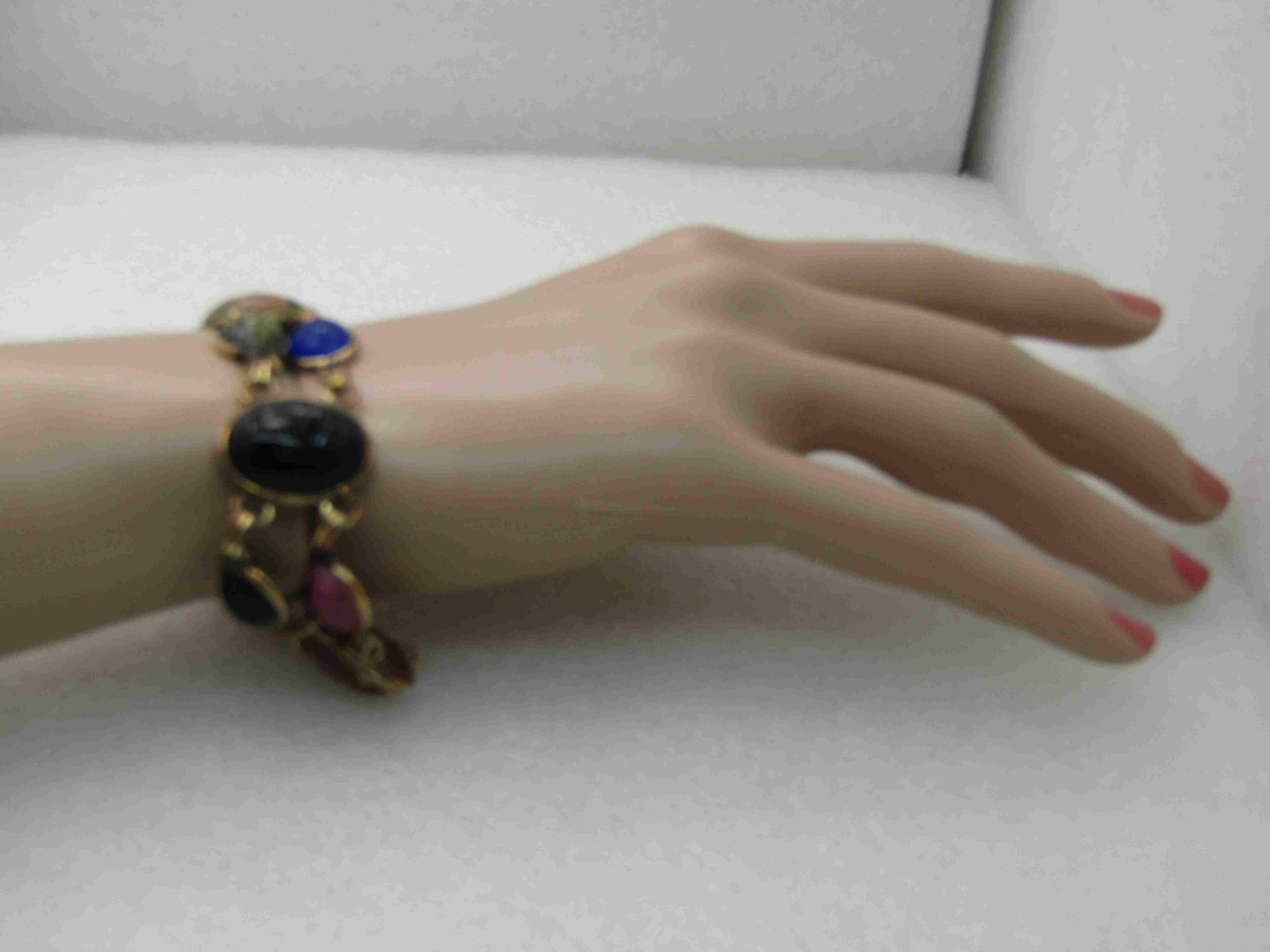 Vintage Egyptian Scarab Bracelet, 12kt G.F. 7.25",: Vintage Egyptian Scarab Bracelet, 12kt G.F. 7.25", Unakite, Carnelian, Onyx, Gold Stone, Jadeite, Blue Chalcedony, nearly 1" wide, Safety Chain that is permanent, spring clasp. Natural stones with the