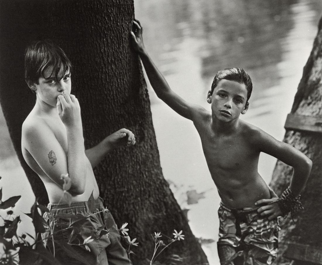 SALLY MANN - Emmett And The White Boy, 1990: Artist: Sally Mann Title: Emmett And The White Boy, 1990 Medium: Photo Litho, 1998, Italy Dimensions: 7.5x6.2" Description: Heat Wax Mounted on 8.5x11" Conservation Board Artist Bio: Sally Mann (1951)