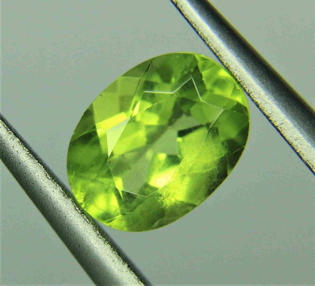 1.26ct Peridot: Title: 1.26ct Peridot Dimensions: 8x6x4 Carat Weight: 1.26 ct Cut/Shape: Oval Additional Information: Reserve: $12.00 Shipping: Domestic: Flat-rate of $10.00 to anywhere within the contiguous U.