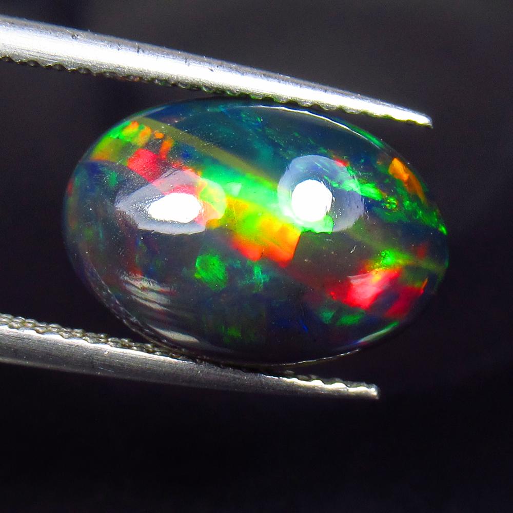 3.12 Ctw Natural Ethiopian Black Fire Opal Oval Cab: No Reserve! Title: 3.12 Ctw Natural Ethiopian Black Fire Opal Oval Cab Stone Clarity: Translucent Gemstones: Black Opal Carat Weights: 3.12 Size/Dimensions: 13.90 x 9.50 x 5.00 mm Additional Informati