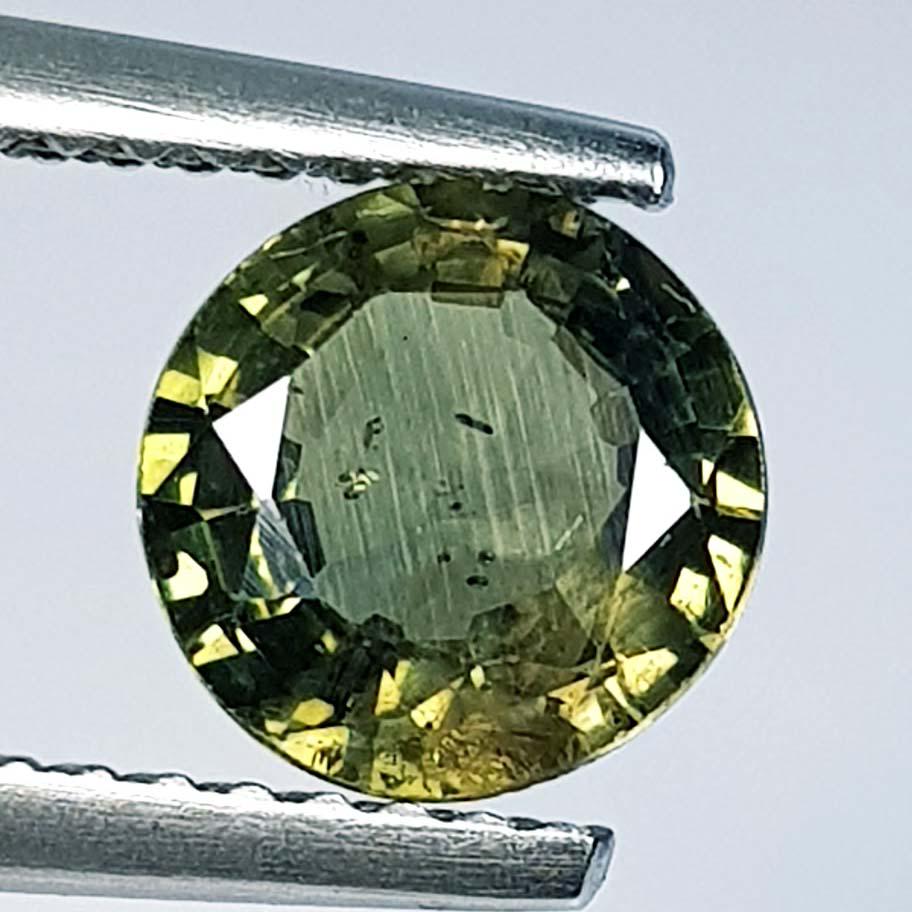 1.40 ct Natural Green Sapphire: No Reserve! Title: 1.40 ct Natural Green Sapphire Color/Clarity: Loosegemstone Gemstones: VS Carat Weights: 1.4 Size/Dimensions: 7.00 x 7.00 x 3.40 Additional Information: Round - Burma Shipping: Do