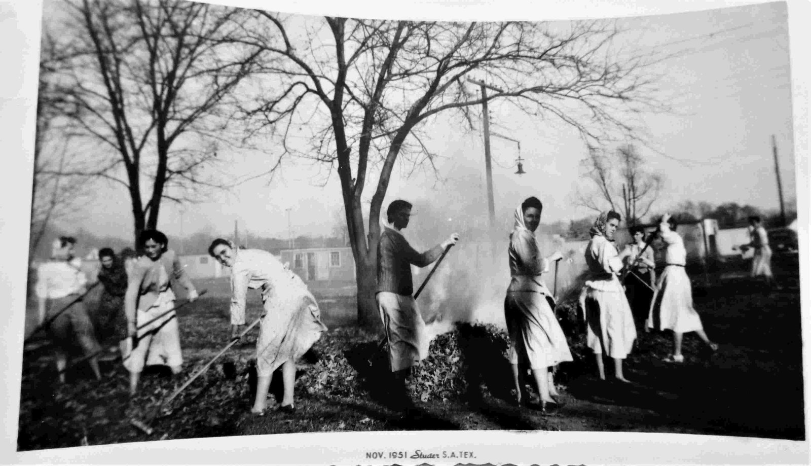 Women With Scarves Raking Leaves: Title: Women With Scarves Raking Leaves Date: 1952 Additional Info: San Antonio, Texas 3.5x5 inch snapshot Reserve: $10.00 Shipping: Domestic: Flat-rate of $6.00 to anywhere within the contiguous U.S.
