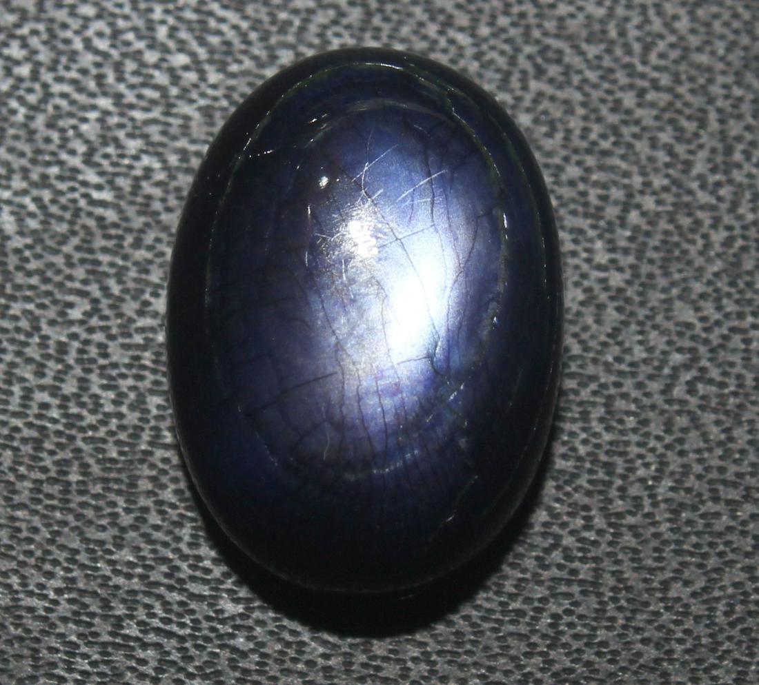 12.42 cts Natural Moonstone: No Reserve! Title: 12.42 cts Natural Moonstone Additional Information: Gemstone : Natural Moonstone Shape : Oval cabochan Weight : 12.42 Carats Measurements : 16.27x1175x8.20 mm Color : Purple Transpr