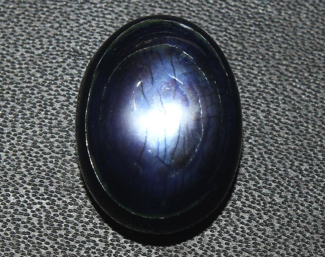 12.09 cts Natural Moonstone: No Reserve! Title: 12.09 cts Natural Moonstone Additional Information: Gemstone : Natural Moonstone Shape : Oval cabochan Weight : 12.09 Carats Measurements : 16.70x12.55x7.98 mm Color : Purple Transp