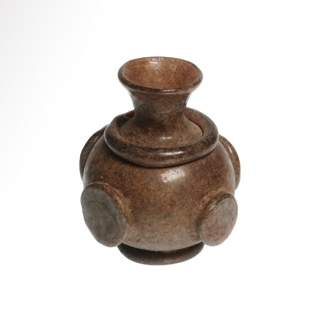 Near Eastern Purple Glass Vessel, c. 6th-7th Century: Title: Near Eastern Purple Glass Vessel, c. 6th-7th Century A.D. Date/Origin: East Mediterranean c. 6th-7th Century A.D. Description: Bulbous body with funnel neck, the body with four applied round me