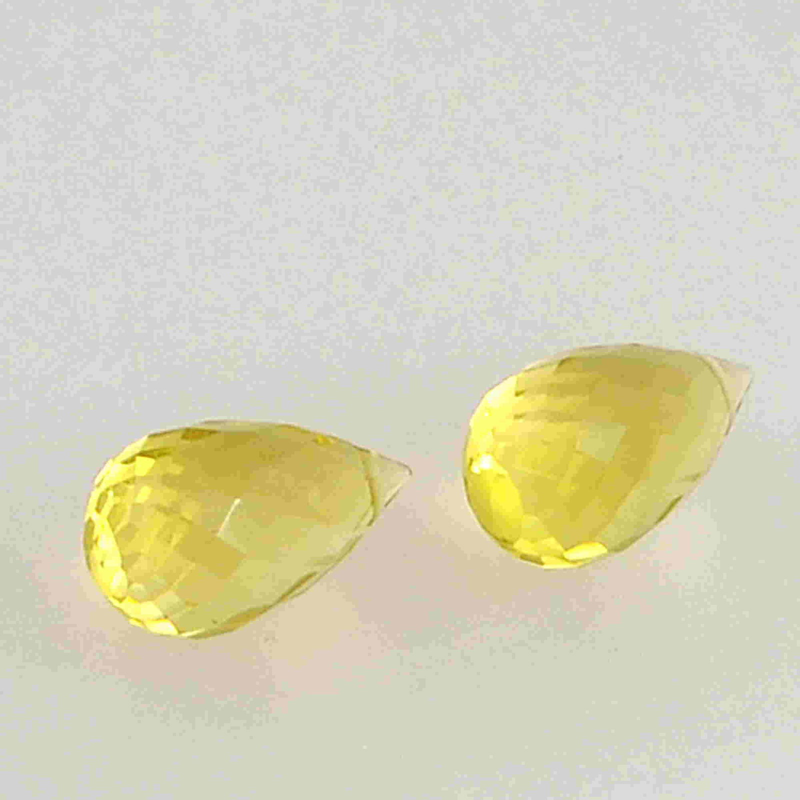 6.3 Carat Yellow Lemon Quartz Loose Gemstone 2 Pieces: No Reserve! Title: 6.3 Carat Yellow Lemon Quartz Loose Gemstone 2 Pieces Additional Information: Specification of Gemstone Name : Lemon Quartz Color : Yellow Total Weight : 6.3 Shape : Drops Cut : Che