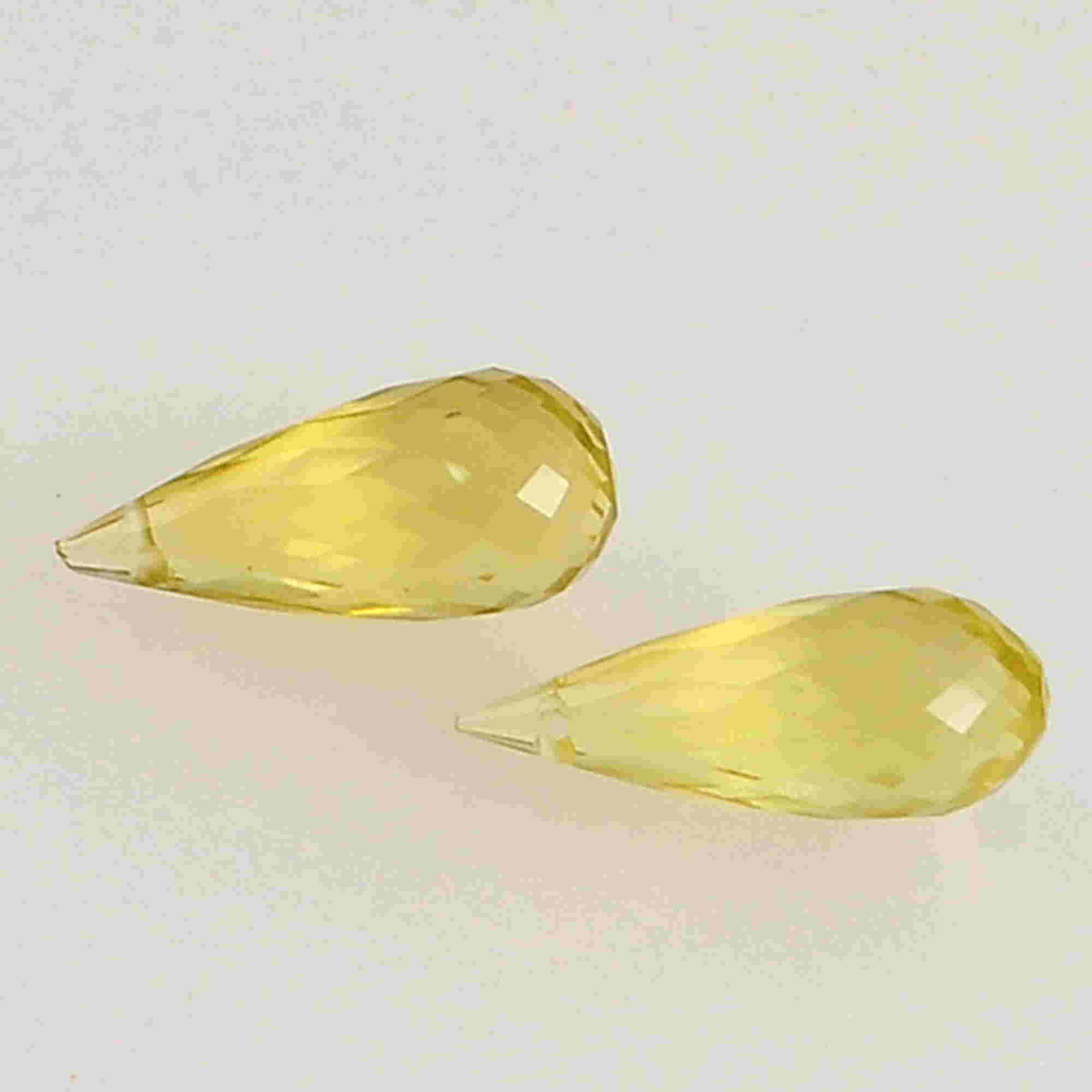 7.3 Carat Yellow Lemon Quartz Loose Gemstone 2 Pieces: No Reserve! Title: 7.3 Carat Yellow Lemon Quartz Loose Gemstone 2 Pieces Additional Information: Specification of Gemstone Name : Lemon Quartz Color : Yellow Total Weight : 7.3 Shape : Drops Cut : Che