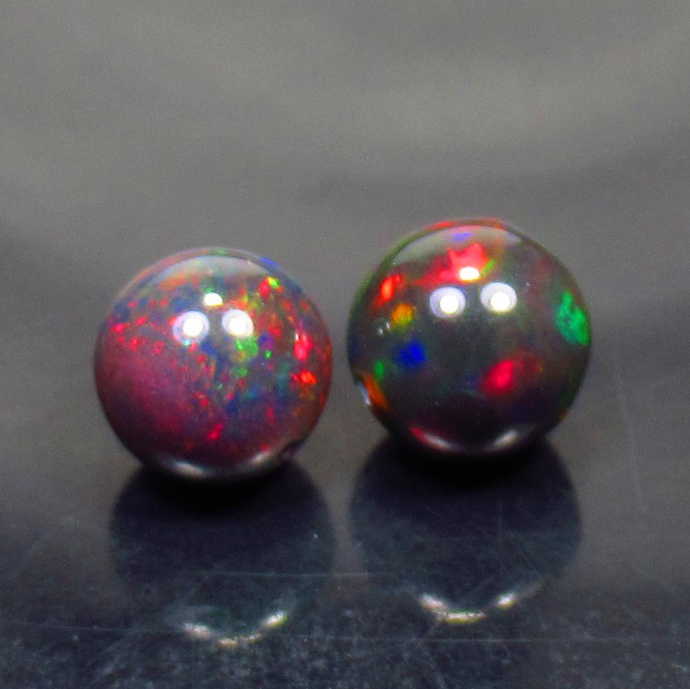 2.83 Ctw Natural 2 Drilled Black Fire Opal Ball Beads: No Reserve! Title: 2.83 Ctw Natural 2 Drilled Black Fire Opal Ball Beads Stone Clarity: Translucent Gemstone: Black Opal Beads Carat Weight: 2.83 Dimesnions: 6.70 to 7.00 mm / 2 PC's Additional Inform