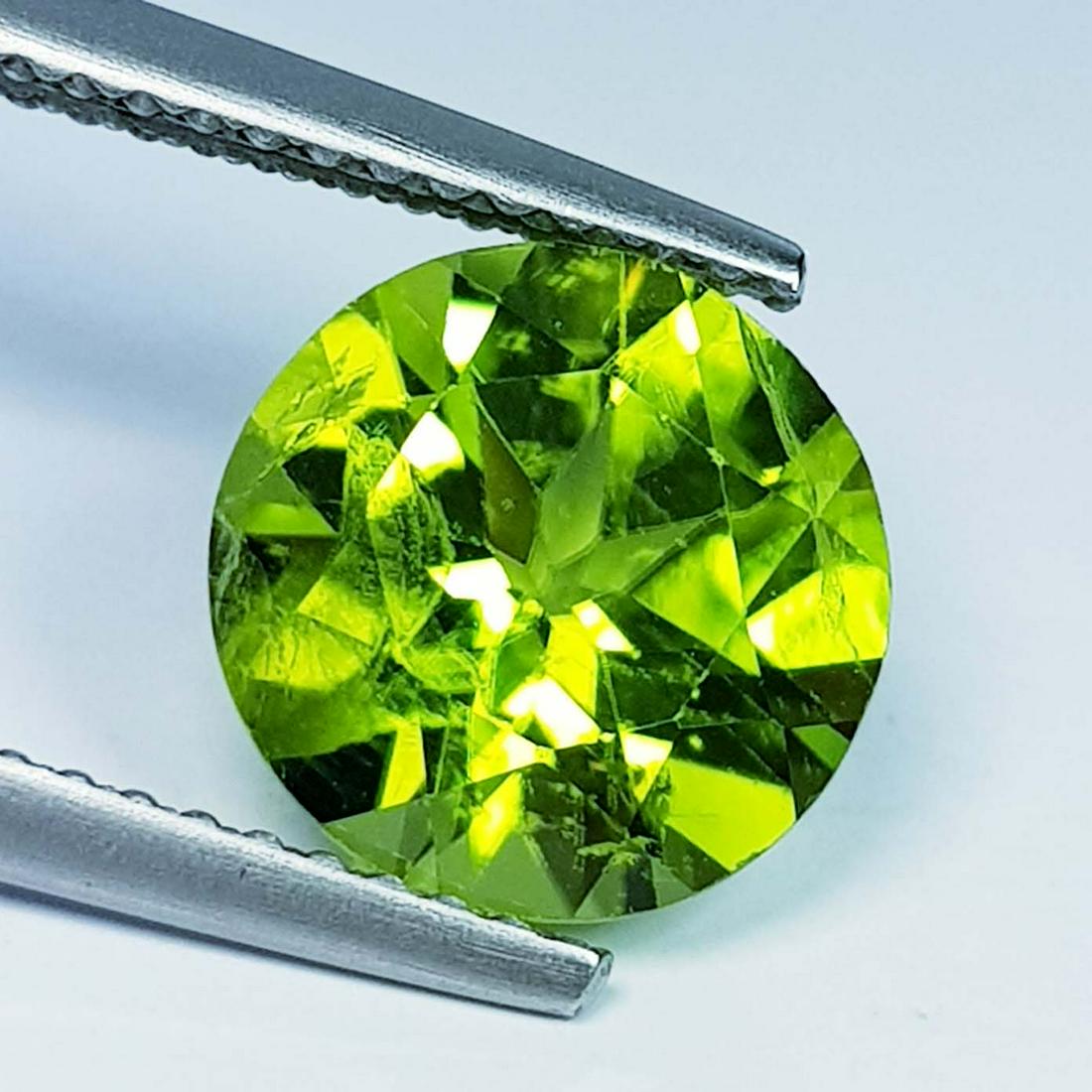 2.98 Ct Natural Peridot Round Cut: No Reserve! Title: 2.98 Ct Natural Peridot Round Cut Stone Color/Clarity: IF - VVS Carat Weight: 2.98 Dimensions: 9.00 x 9.00 x 5.70 Additional Information: Round / Pakistan Shipping: Domestic: Flat-