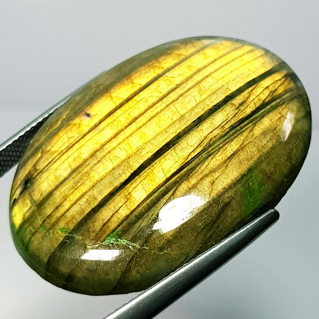 50.48 Ct Natural Labradorite: No Reserve! Title: 50.48 Ct Natural Labradorite Stone Color/Clarity: Opaque Carat Weight: 50.48 Dimensions: 36.55 x 25.90 x 6.40 Additional Information: Oval - USA Shipping: Domestic: Flat-rate o