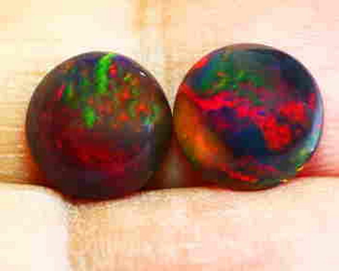 Pair of Natural Black Opal (2 Stones) 1.15tcw Round: Title: Pair of Natural Black Opal (2 Stones) 1.15tcw Round Rainbow Flashy Volcanic Glow 3D Honey Comb Pattern VVS Additional Information: 1 x Pair (2 Stones) of Natural Black Opal 1.15tcw Round Rainbo