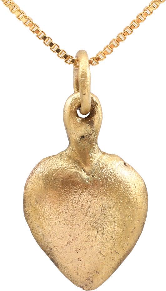 VIKING HEART PENDANT, 900 AD: An early example of the fully evolved form. domed form with a hollow back. The deeply cusped top heart is indicative of a full transition from the naturalistic form which was used widely as well. Made