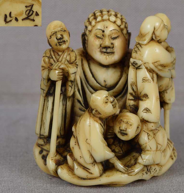 19c marine netsuke BLIND & BUDDHA by GYOKUZAN ex Tagg,: 19th century marine netsuke of five blind men exploring a large statue of Buddha. The subject is a clever version of the parable of the blind men and the elephant - each blind man touching a different