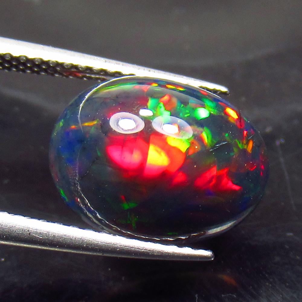 3.50 Ct Natural Ethiopian Black Fire Opal Oval Cab: No Reserve! Title: 3.50 Ct Natural Ethiopian Black Fire Opal Oval Cab Stone Clarity: Opaque Gemstone: Natural Black Opal Carat Weight: 3.5 Size/Dimensions: 12.70 x 9.90 x 6.20 mm Additional Informatio