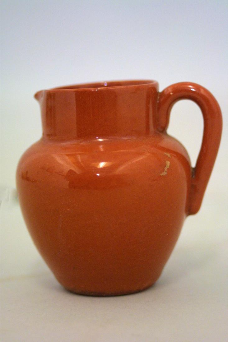 A mini redware pitcher: Title: A mini redware pitcher Provenance/Additional Info: A mini redware pitcher - c. 1880 - Size: 2 1/2" H x 2 1/2" W - Condition: very good Shipping: Domestic: Flat-rate of $10.00 to anywhere within