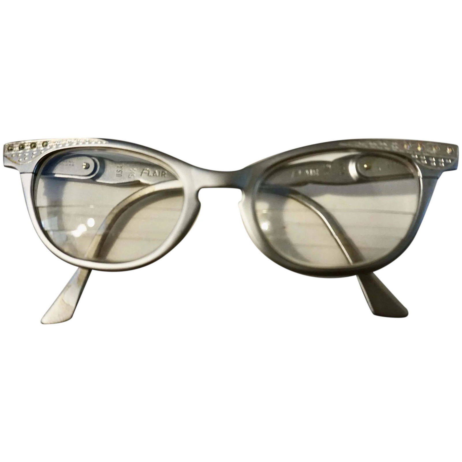 Vintage 1950s FLAIR made in Usa aluminum eye glasses: Replace the lenses in these vintage Flair frames with your own prescription for a fabulous look. alluminum frames, detailed with rhinestones made in usa 1950s glasses. Shipping: Domestic: Flat-rate of