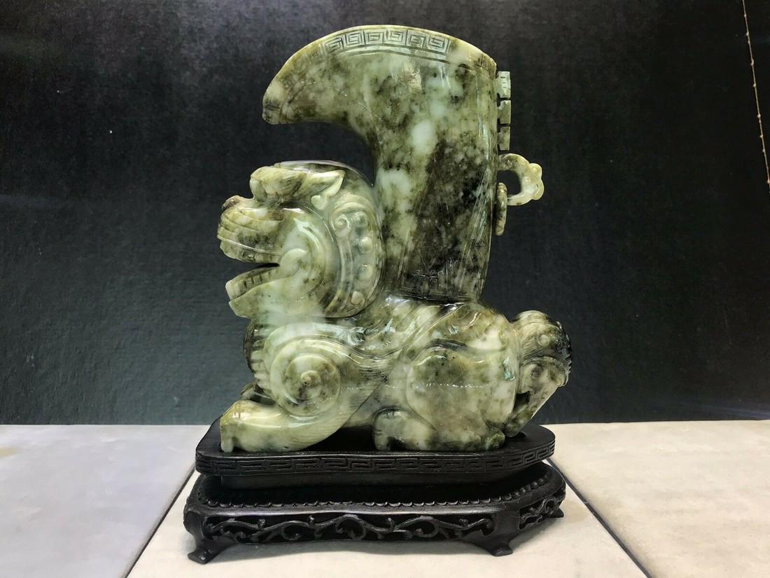 Chinese Foo Dog guardian vessel figure statue bowl: Title: Chinese Foo Dog guardian vessel figure statue bowl Description: Foo Dog vessel is in good condition.Made of porcelain and with black wooden stand.Beautiful color. No chips, cracks, or crazing.S
