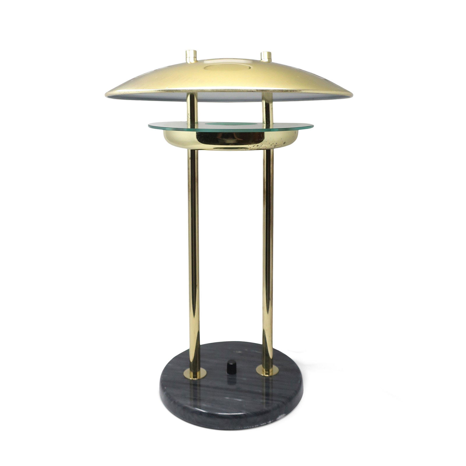 1980s Flying Saucer Table Lamp with Marble Base: An iconic postmodern flying saucer table lamp in style of Robert Sonneman for George Kovacs. Dark gray marble base, brass upright supports and brass shade. Shade reflects light up through opening on i