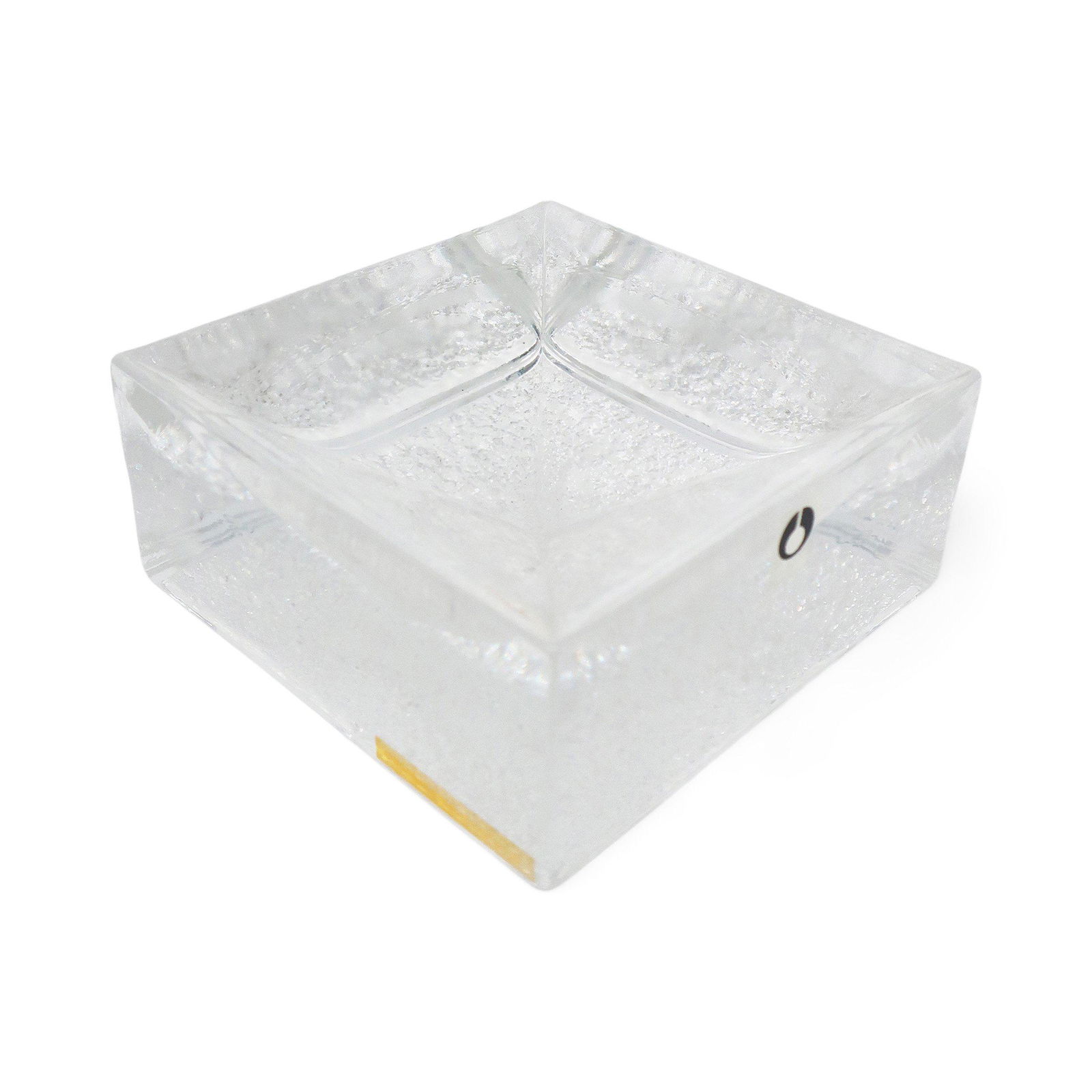 Swedish Modern Glass Dish by Eva Englund for Pukeberg: A beautiful Scandinavian Modern cast glass designed by Eva Englund for Swedish glass maker Pukeberg that can be used as a catchall, vide-poche, or an ashtray. Square in shape with an textured undersid