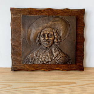 Bronze Man face relief on oak plate: Title: Bronze Man face relief on oak plateMaker: UnknownOrigin: UnknownDate/Period: UnknownMaterials: Bronze / OakSize:Size: 17.5 x 15.0 x 2.5 cm Description: Bronze Man face relief on oak plateSize: